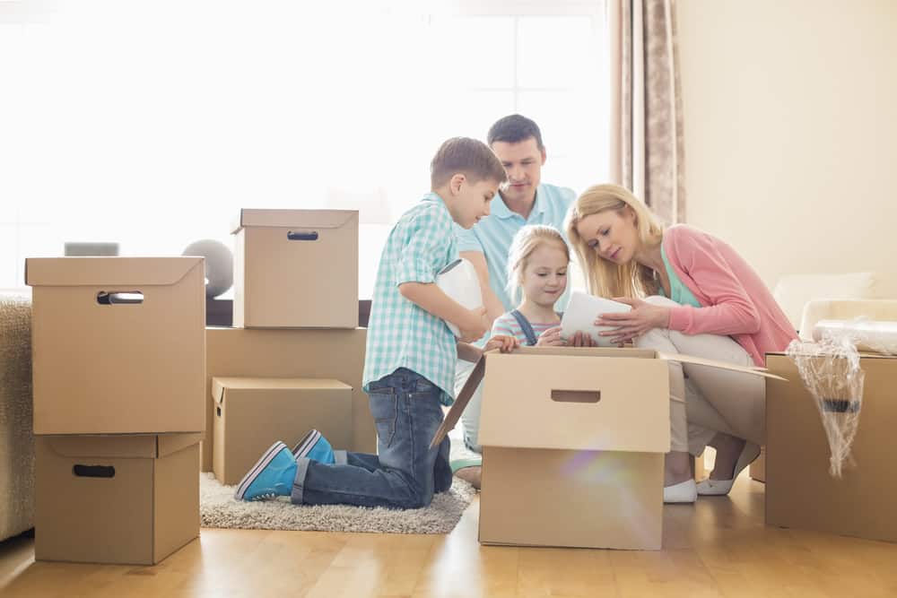 Happy Family unpacking their Things — Removalist in Brisbane, QLD
