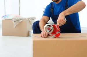 Man Packing Items Inside a Box — Removalist in Brisbane, QLD