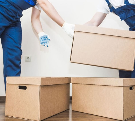 Delivery man loading cardboard boxes — Removalist in Brisbane, QLD