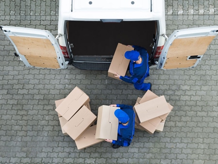 Top View of Two Removalists Unloading Boxes out of the Van — Removalist in Brisbane, QLD
