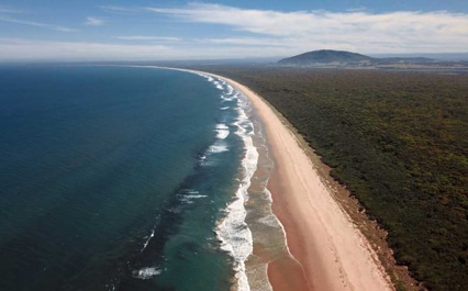 An aerial view of Seven Mile Beach — Removalist in Brisbane, QLD